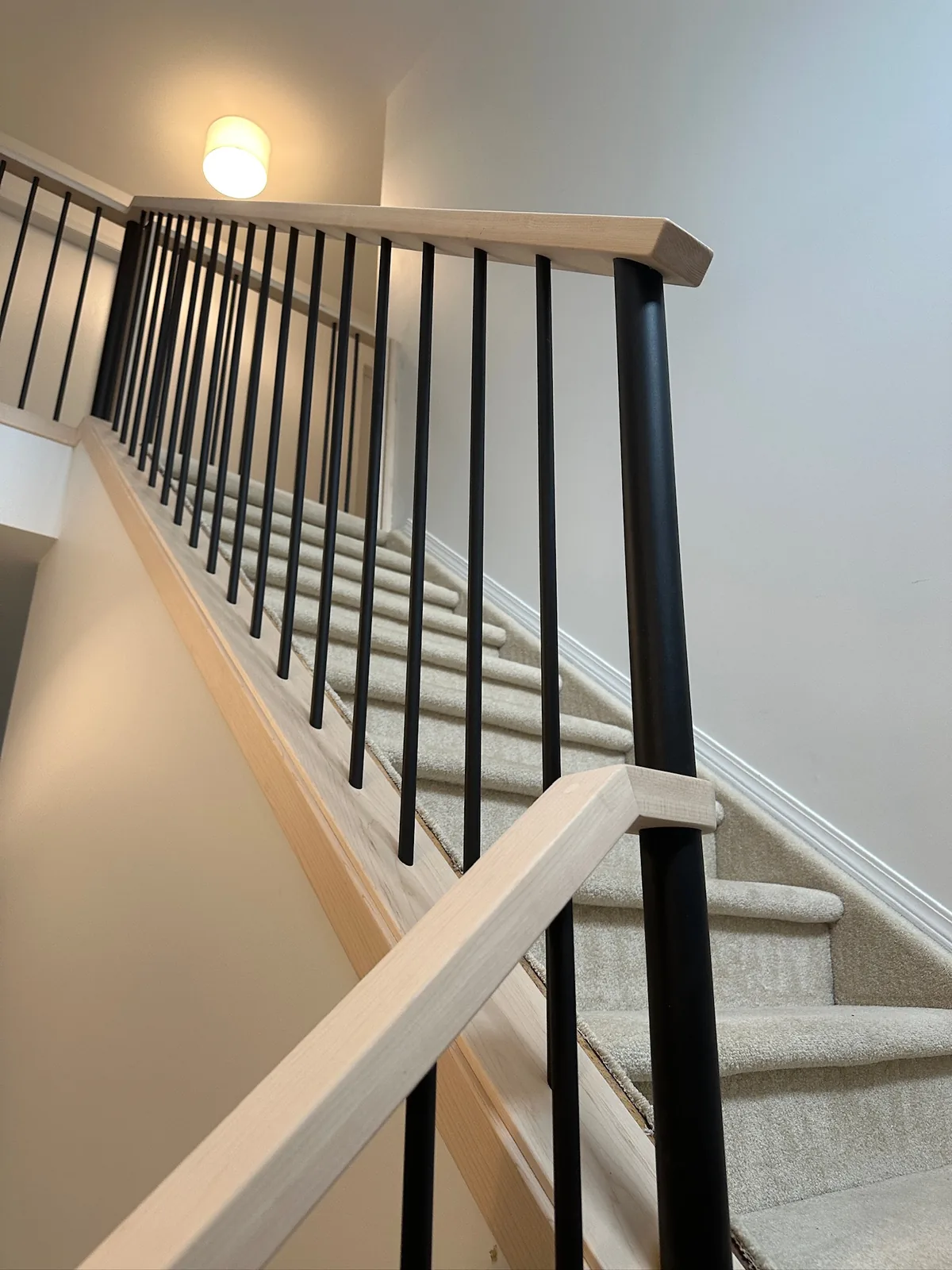 Custom staircase and railing built by Ben's Carpentry in the Edmonton area